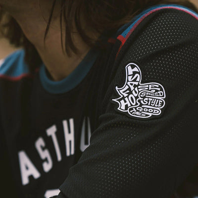 Fasthouse Grindhouse Air-Cooled Club Jersey Black/Teal - Lifestyle Close-Up of Left Sleeve Patch