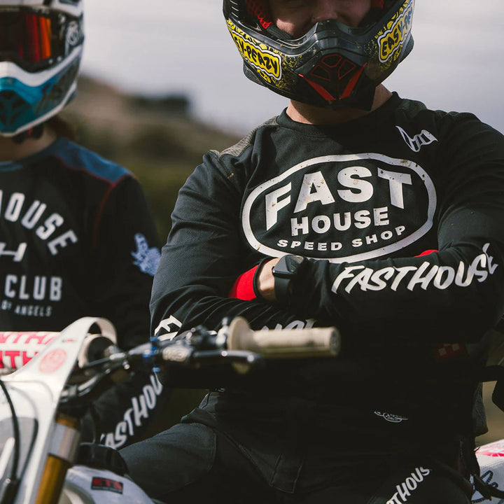 Fasthouse Grindhouse Air-Cooled Ramble Jersey Black/Gray - Lifestyle Shot of Rider Wearing Jersey with Arms Crossed