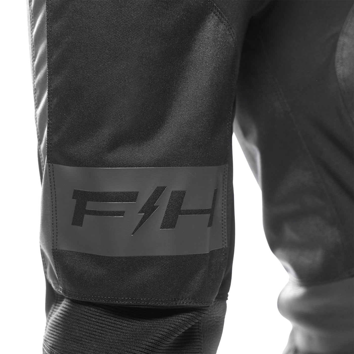 Fasthouse Grindhouse Club Pants Black/Gray - Close-Up of Front Right Thigh Graphics