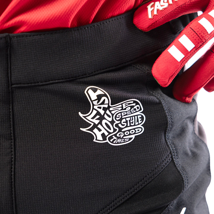 Fasthouse Grindhouse Club Pants Black/Gray - Close-Up of Front Left Waist Graphic