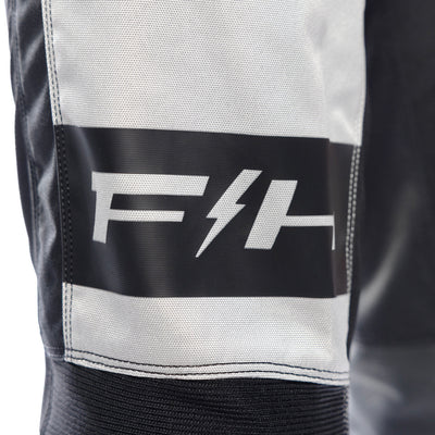 Fasthouse Grindhouse Club Pants Light Gray/Black/Teal - Close-Up of Front Right Graphics
