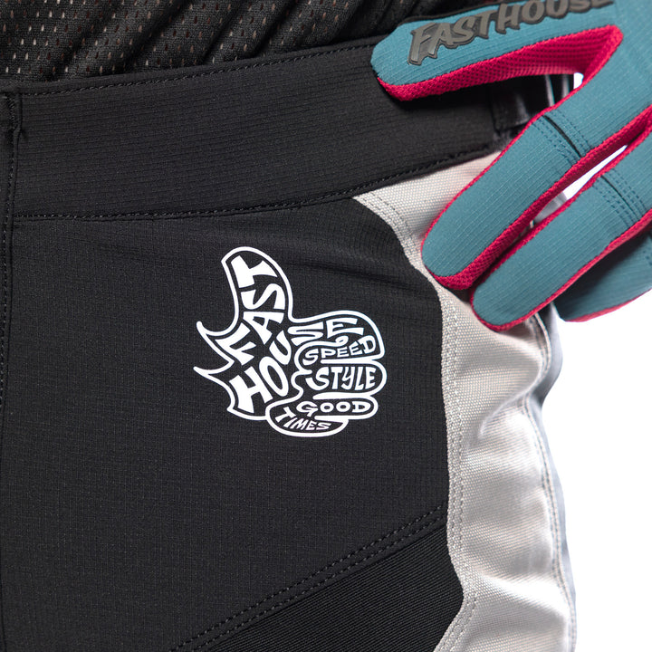 Fasthouse Grindhouse Club Pants Light Gray/Black/Teal - Close-Up of Front Left Waist Graphic