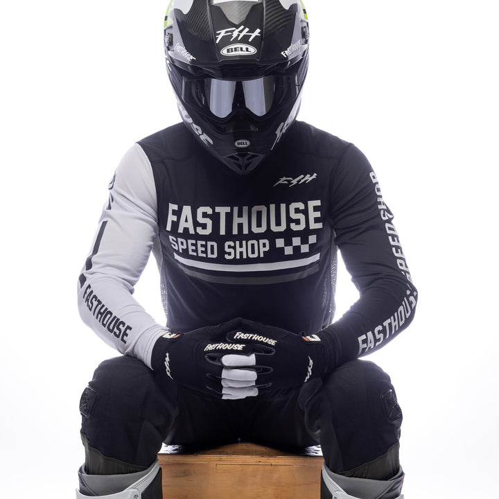 Fasthouse Grindhouse Hudson Jersey Black/White - Front View of Model Sitting While Wearing Jersey