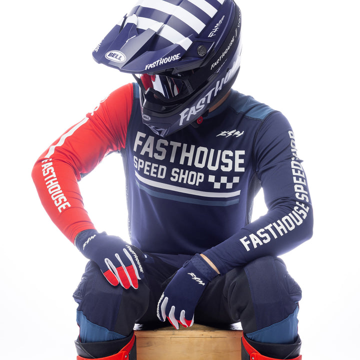 Fasthouse Grindhouse Hudson Jersey Blue/Red - Front View of Model Sitting While Wearing Jersey