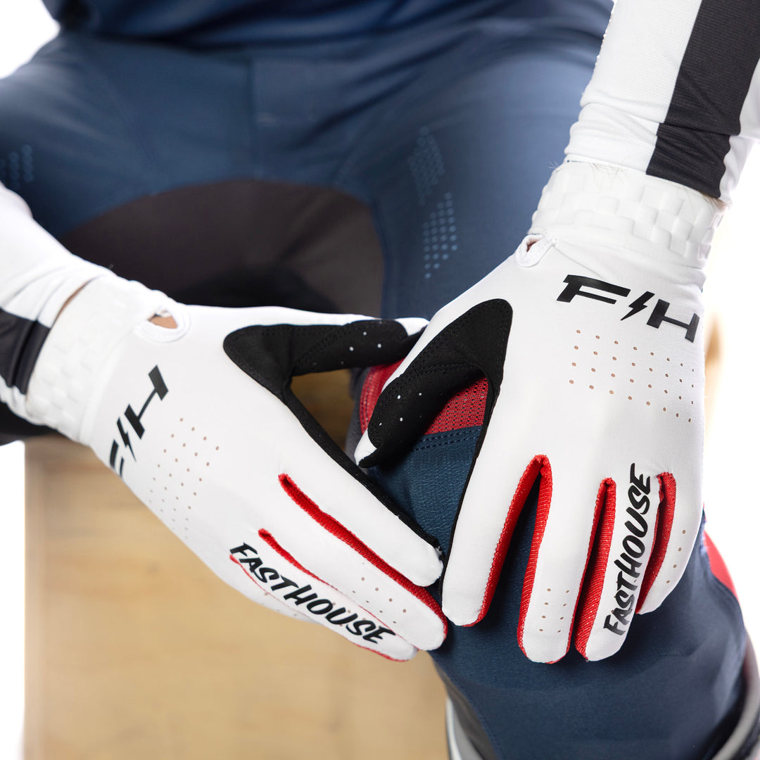 Fasthouse Helix Circuit Gloves White - Close-Up of Model Wearing Gloves, Hands Resting on Left Knee