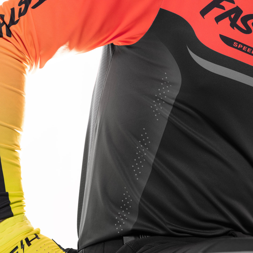 Fasthouse Helix Circuit Jersey Hyper Coral/Black - Close-Up of Rib Panel with Laser-Cut Venting