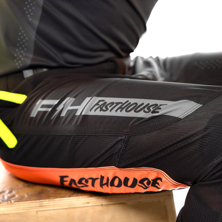 Fasthouse Helix Circuit Pants Black/Hyper Coral - Close-Up of Right Thigh Graphics