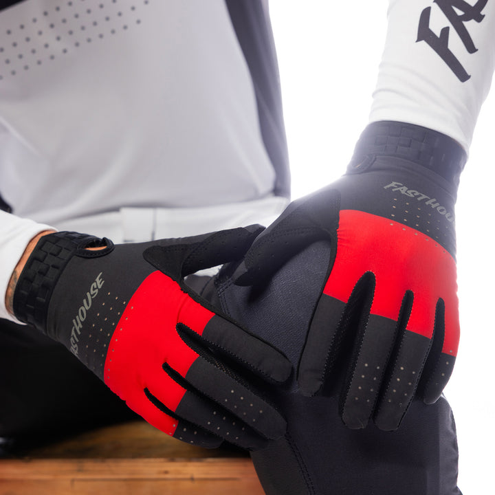 Fasthouse Helix Monaco Gloves Red/Black - Close-Up of Model's Gloved Hands Resting on Knee