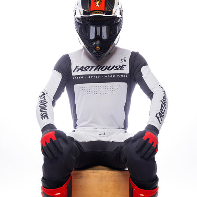 Fasthouse Helix Monaco Jersey Black/White - Front View of Model Sitting While Wearing Jersey
