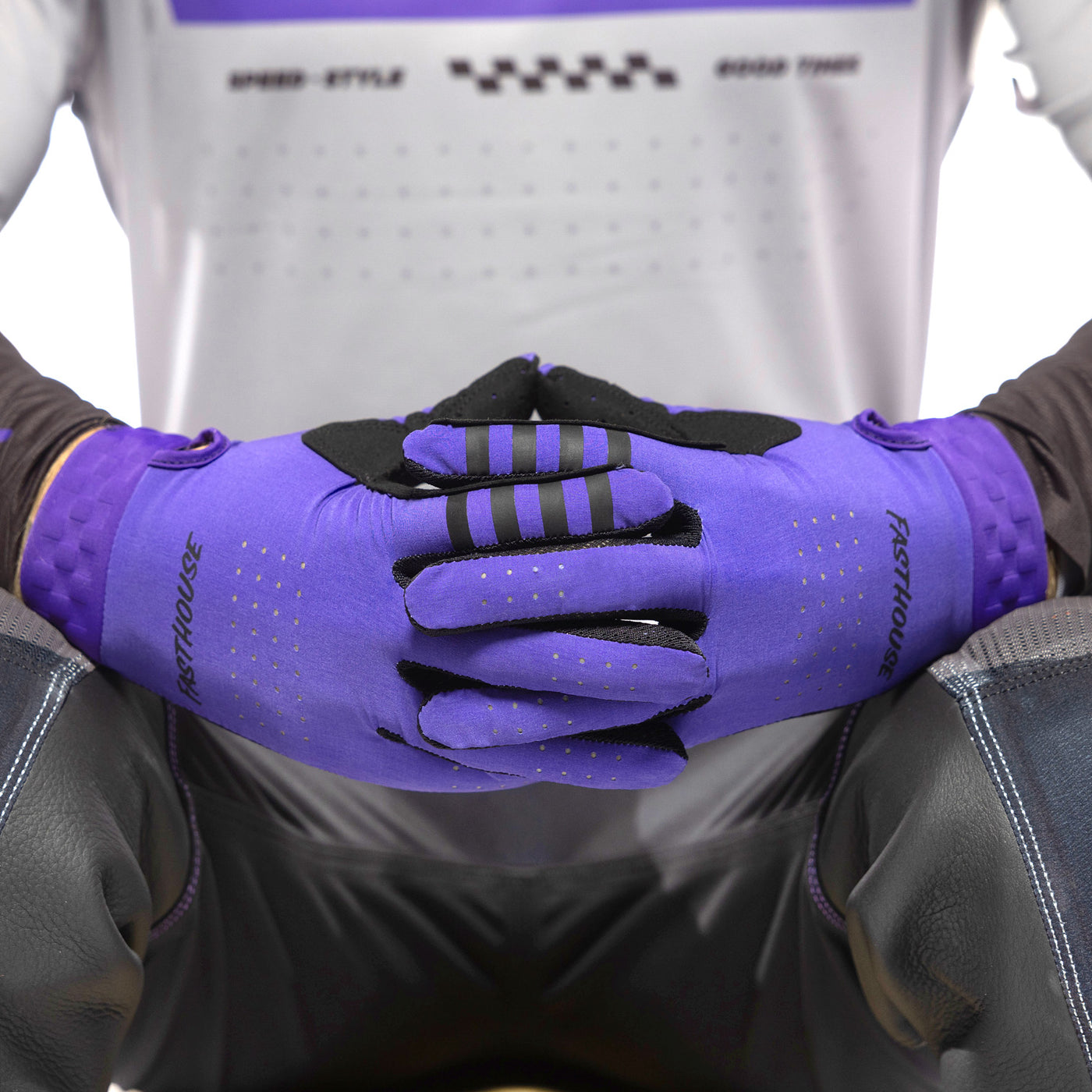 Fasthouse Helix Podium Gloves Purple - Close-Up of Gloved Hands with Fingers Entwined