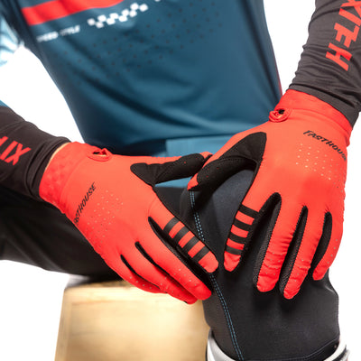 Fasthouse Helix Podium Gloves Red - Close-Up of Gloved Hands Resting on Knee