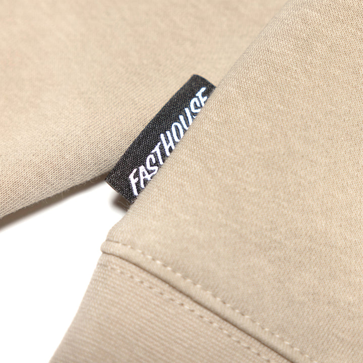 Fasthouse Krest Hooded Pullover Sand - Close-Up of Brand Tag on Hem