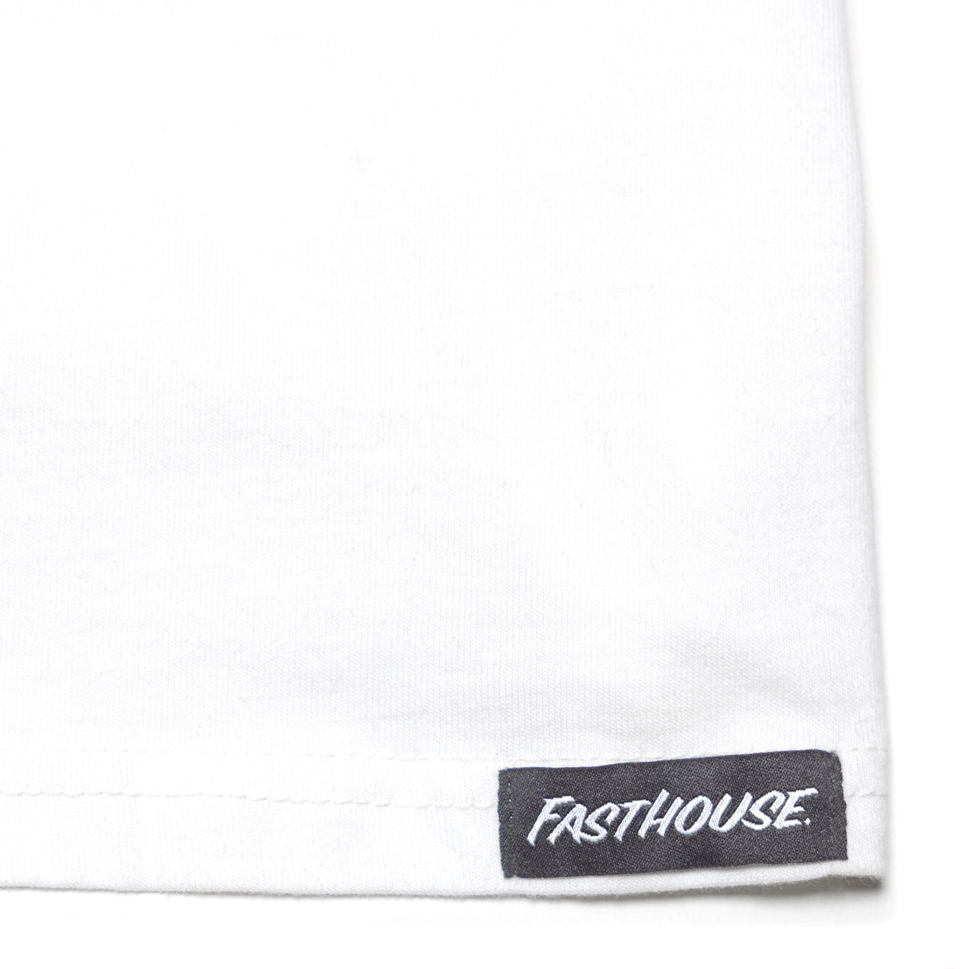 Fasthouse Krest LS Tee White - Close-Up of Brand Tag on Hem