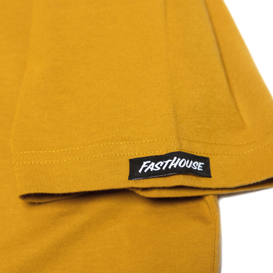 Fasthouse Krest SS Tee Vintage Gold - Close-Up of Brand Tag on Sleeve