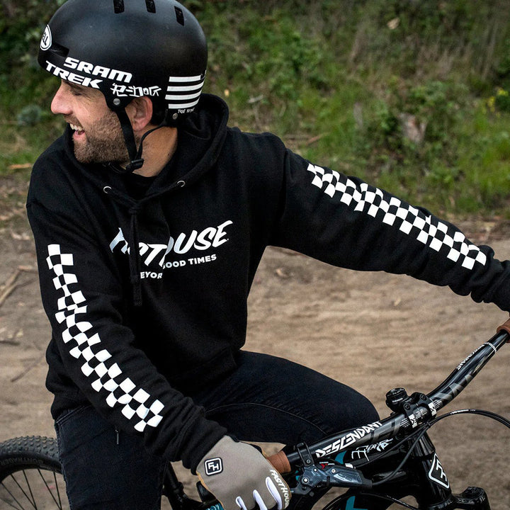 Fasthouse Logo Hooded Pullover Black - Lifestyle Shot of Rider Wearing Pullover while on Bicycle Trail
