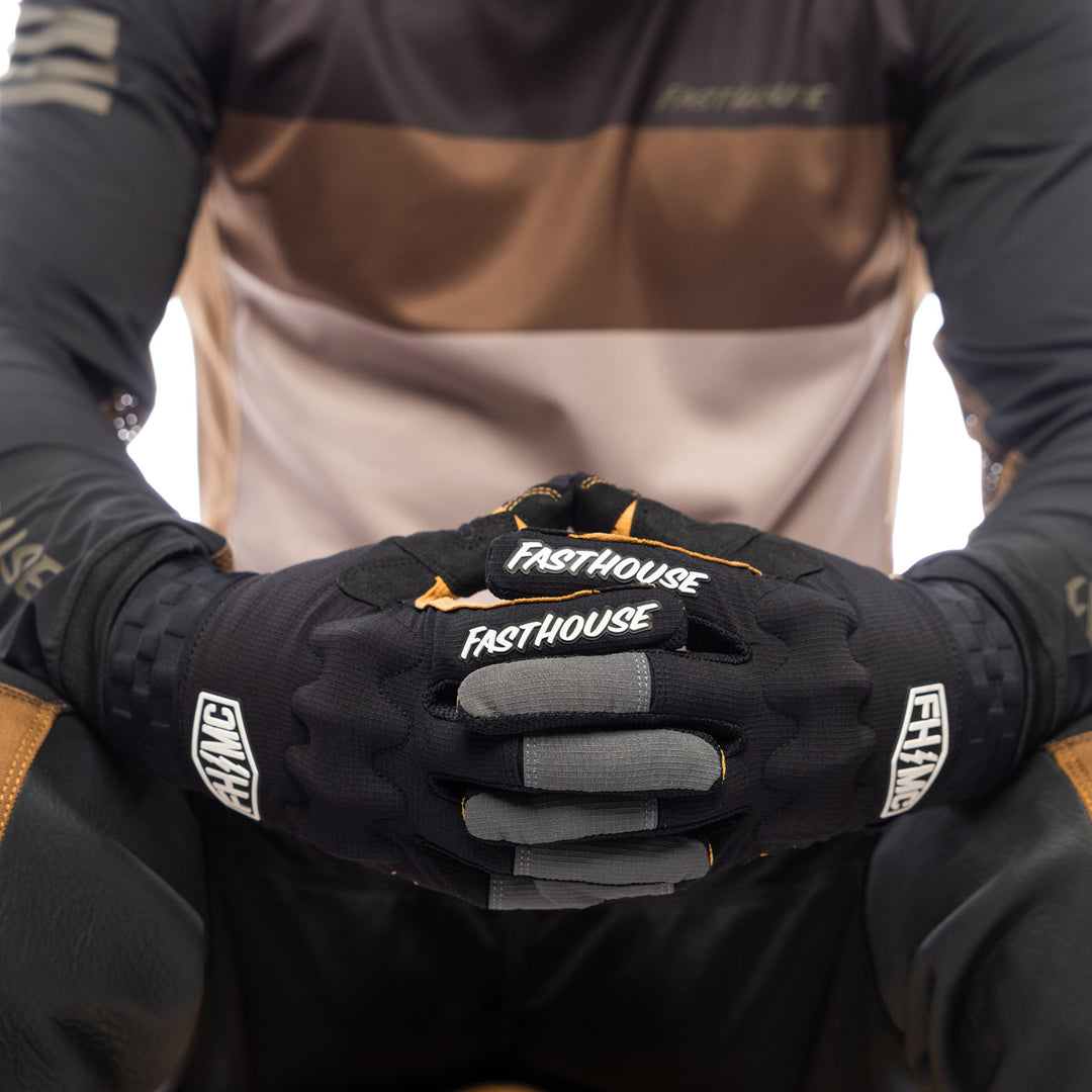 Fasthouse Off-Road Blaster Shield Gloves Black - Close-Up of Model's Gloved Hands Together, Fingers Entwined