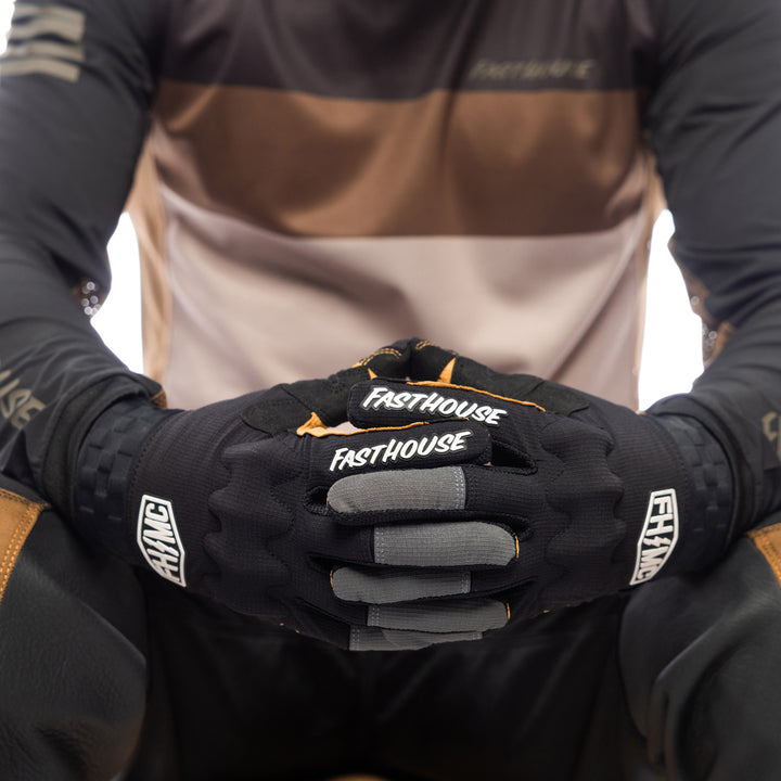 Fasthouse Off-Road Blaster Shield Gloves Black - Close-Up of Model's Gloved Hands Together, Fingers Entwined