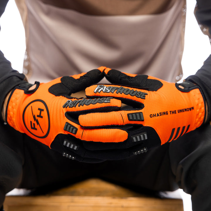 Fasthouse Off-Road Matox Gloves Orange - Close-Up of Model's Gloved Hands Together, Fingers Entwined