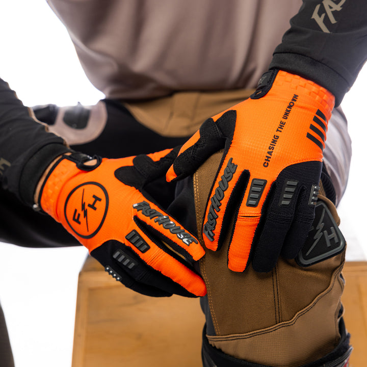 Fasthouse Off-Road Matox Gloves Orange - Close-Up of Model's Gloved Hands Resting on Knee