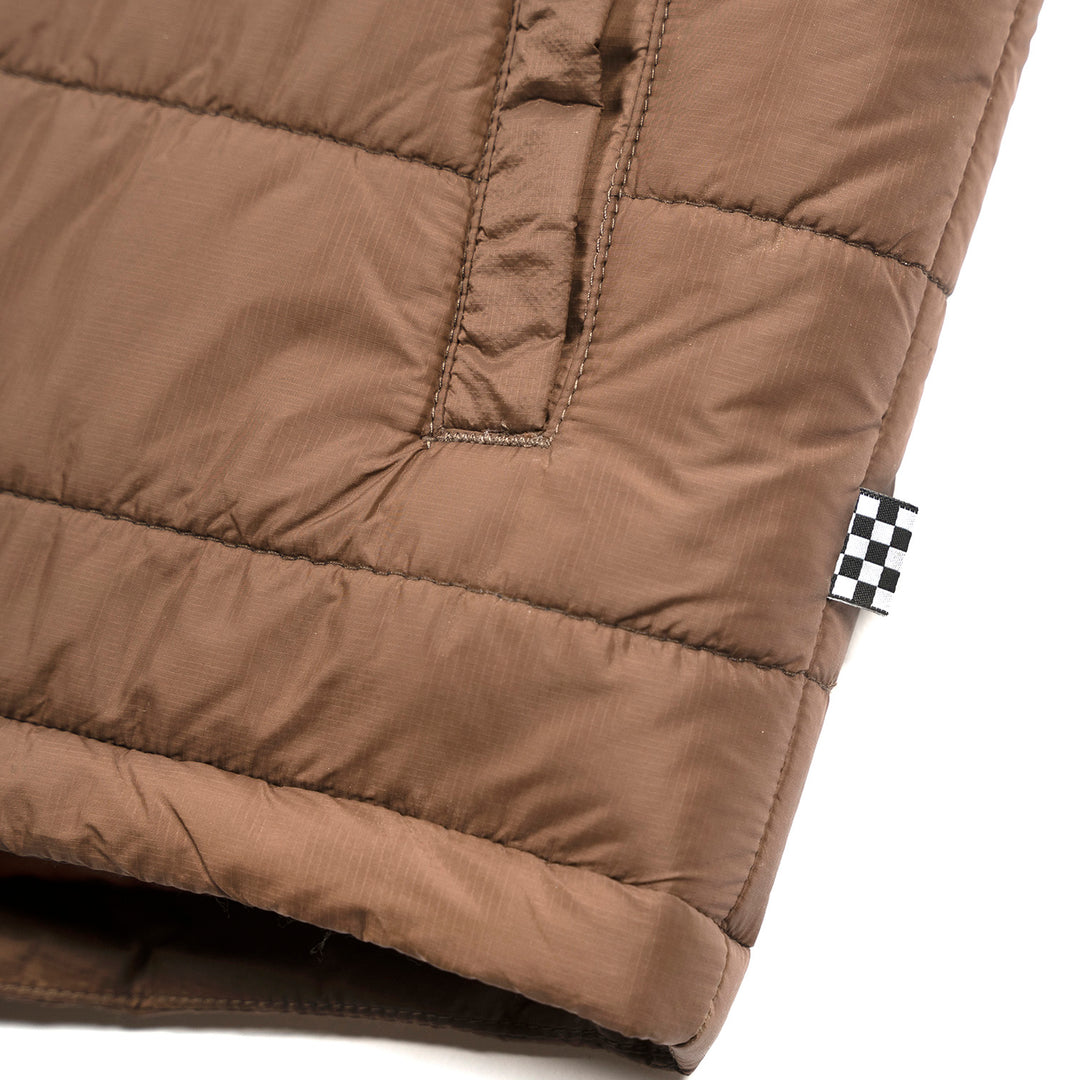 Fasthouse Prospector Puffer Vest Black/Brown - Close-Up of Tag Sewn into Seam