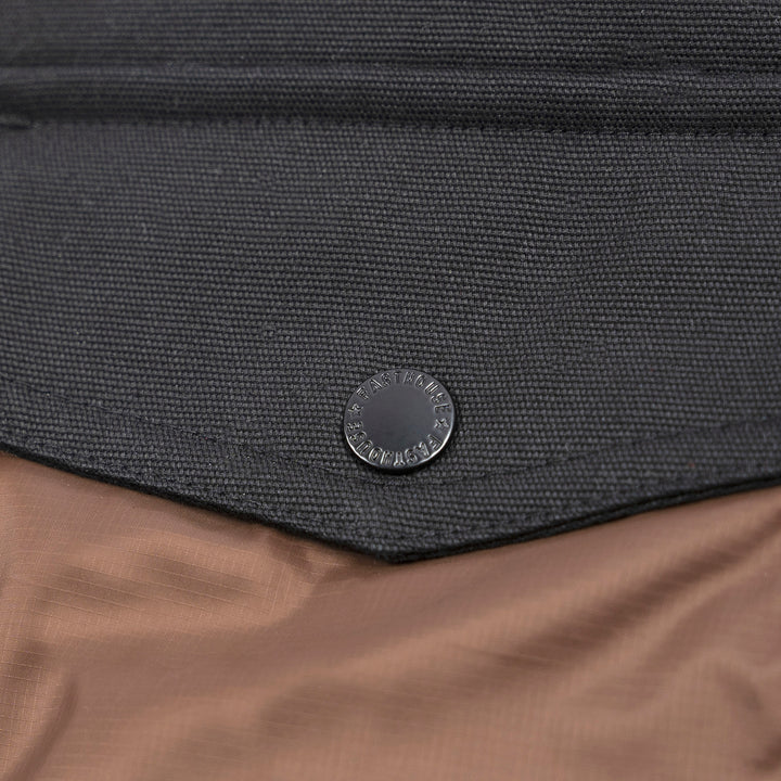 Fasthouse Prospector Puffer Vest Black/Brown - Close-Up of Button on Chest Pocket