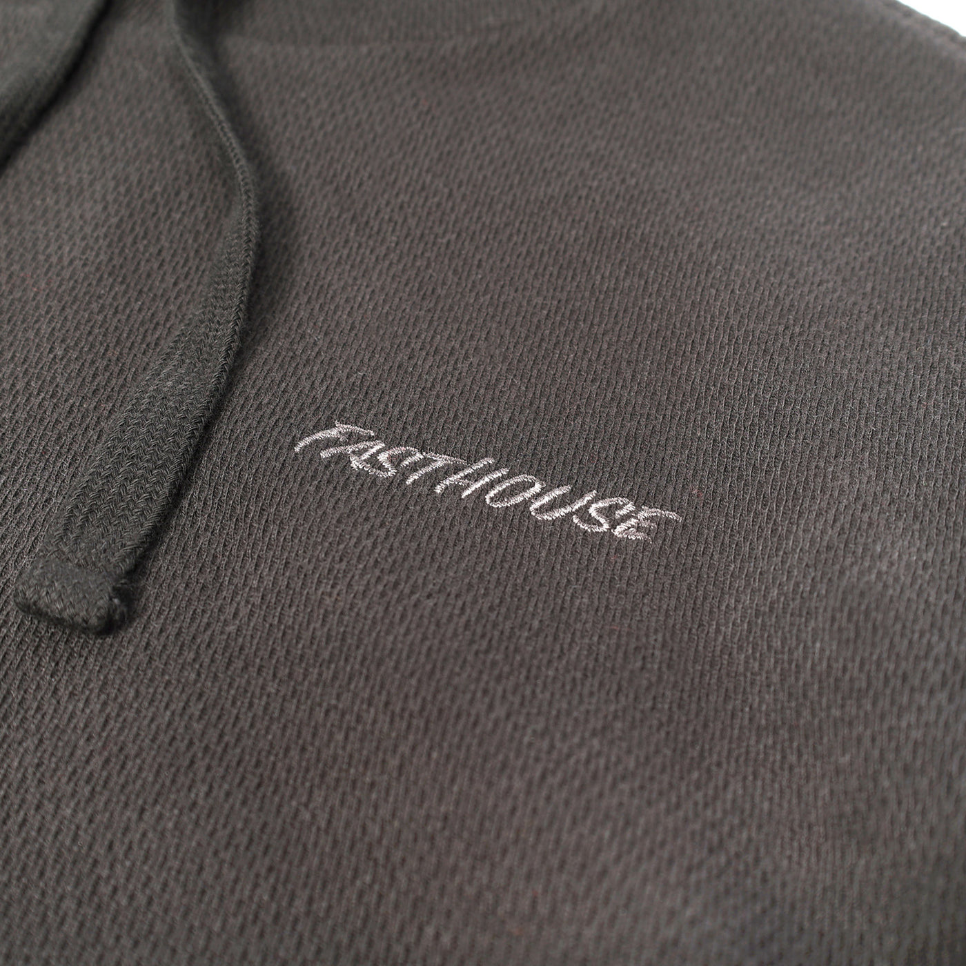 Fasthouse Robin Hooded Thermal Black - Close-Up of Stitched Logo on Front Chest