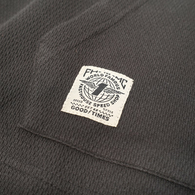 Fasthouse Robin Hooded Thermal Black - Close-Up of Patch Label on Kangaroo Pocket
