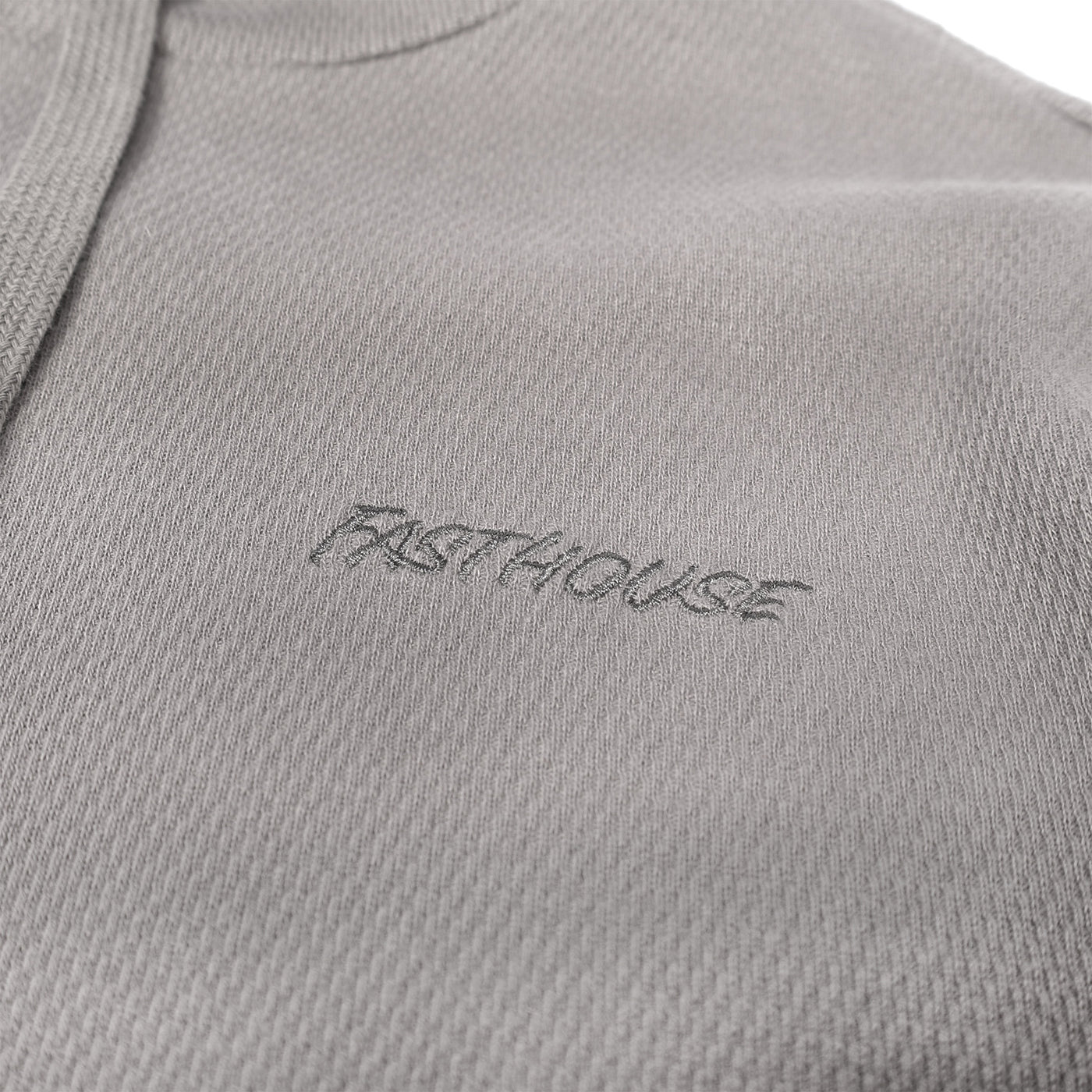 Fasthouse Robin Hooded Thermal Cloud Gray - Close-Up of Stitched Logo on Front Chest