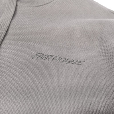 Fasthouse Robin Hooded Thermal Cloud Gray - Close-Up of Stitched Logo on Front Chest