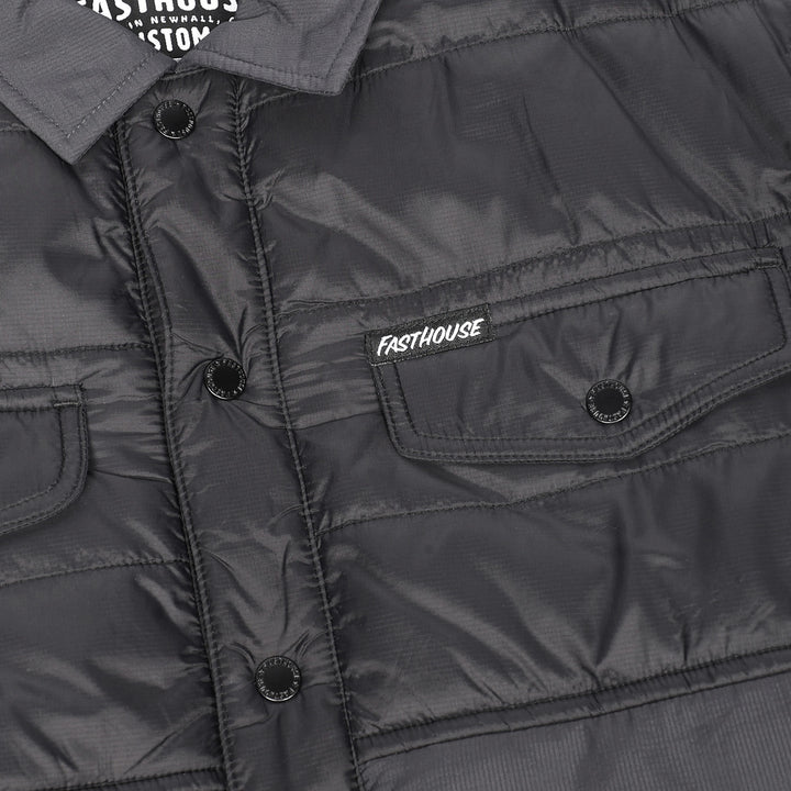 Fasthouse Sequoia Jacket Black/Black - Close-Up of Front Pocket with Logo Tag