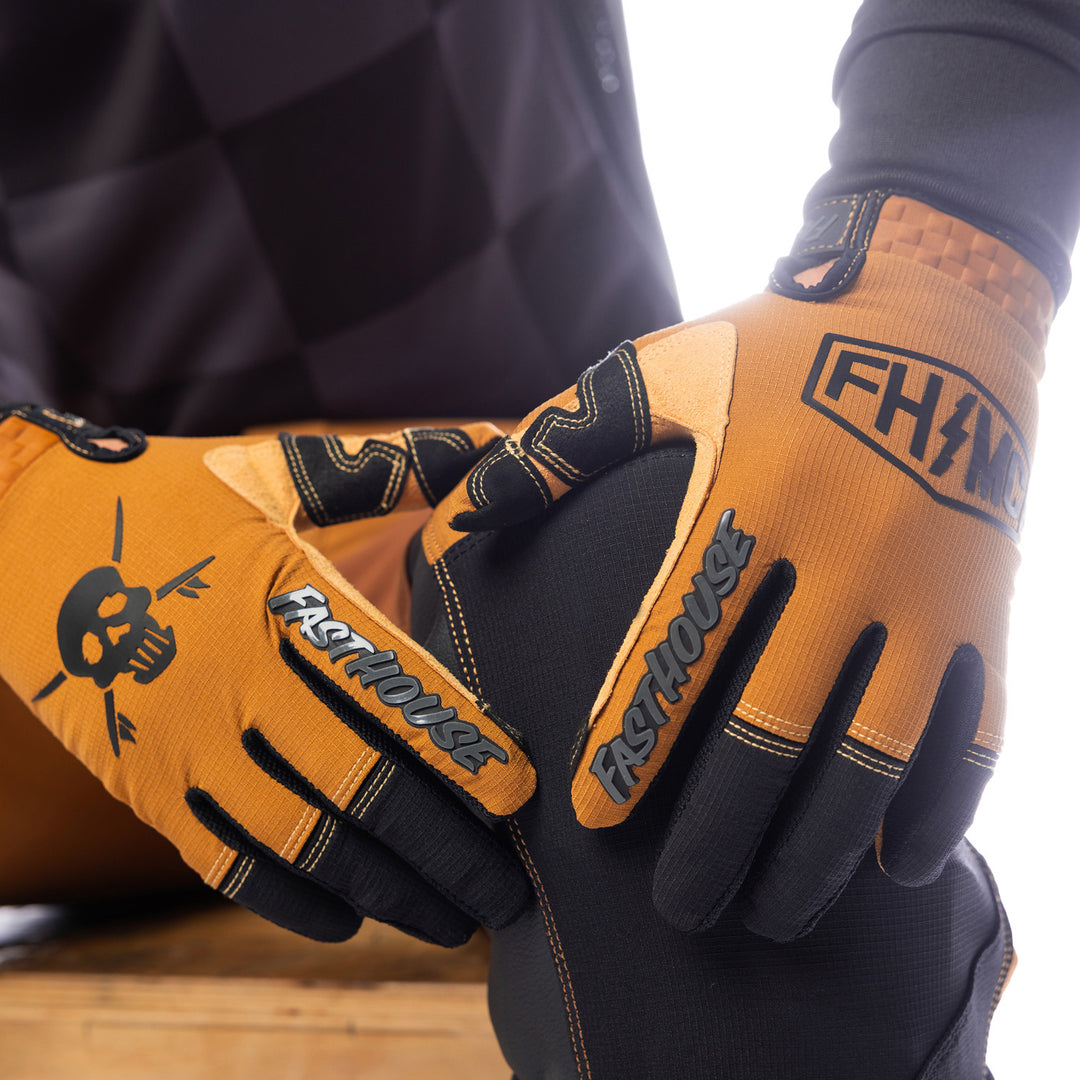 Fasthouse Sanguaro Bennet Gloves Camel - Close-Up of Model's Gloved Hands Resting on Knee