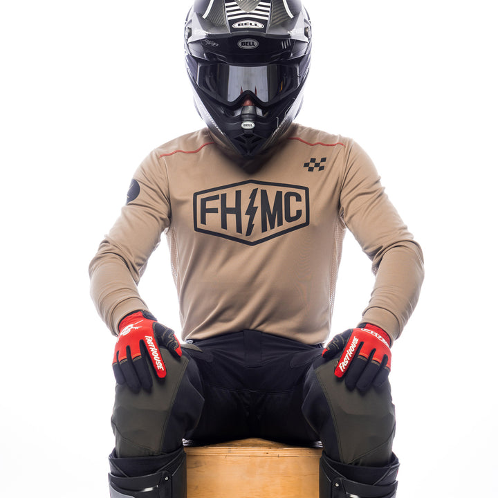 Fasthouse Sanguaro Bennet Jersey Moss - Front View of Model Sitting While Wearing Jersey