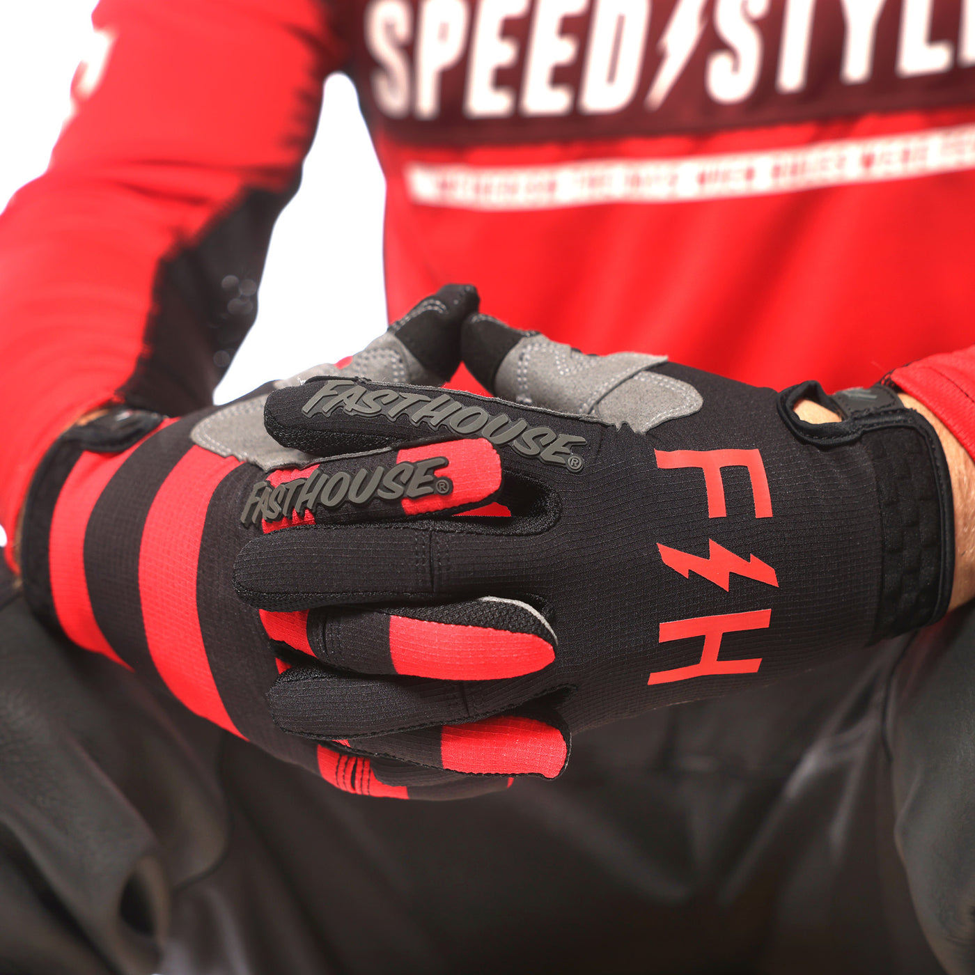 Fasthouse Speed Style Akin Gloves Black/Red - Close-Up of Gloved Hand with Fingers Entwined