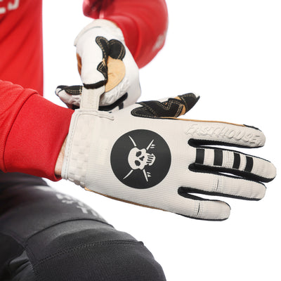 Fasthouse Speed Style Baja Gloves White Sand - Close-Up of Model Adjusting Glove's Wrist Strap