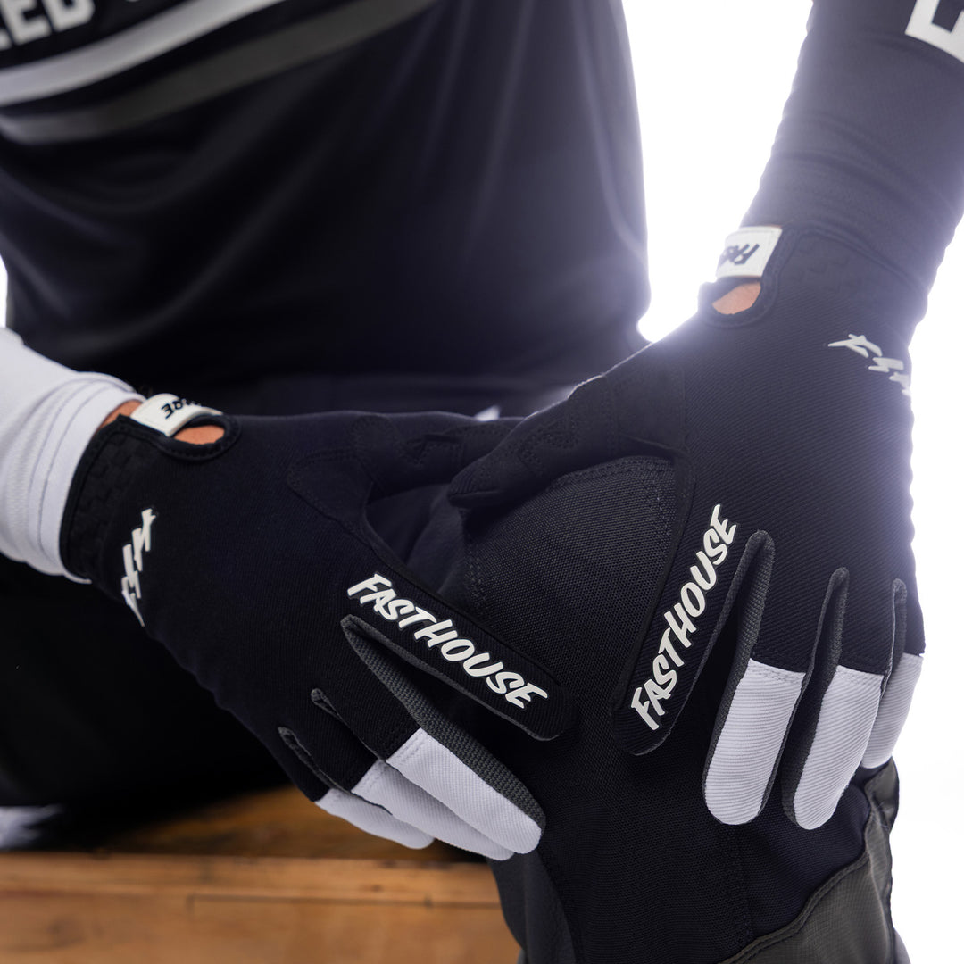 Fasthouse Speed Style Hudson Gloves Black/White - Close-Up of Model's Gloved Hands Resting on Knee