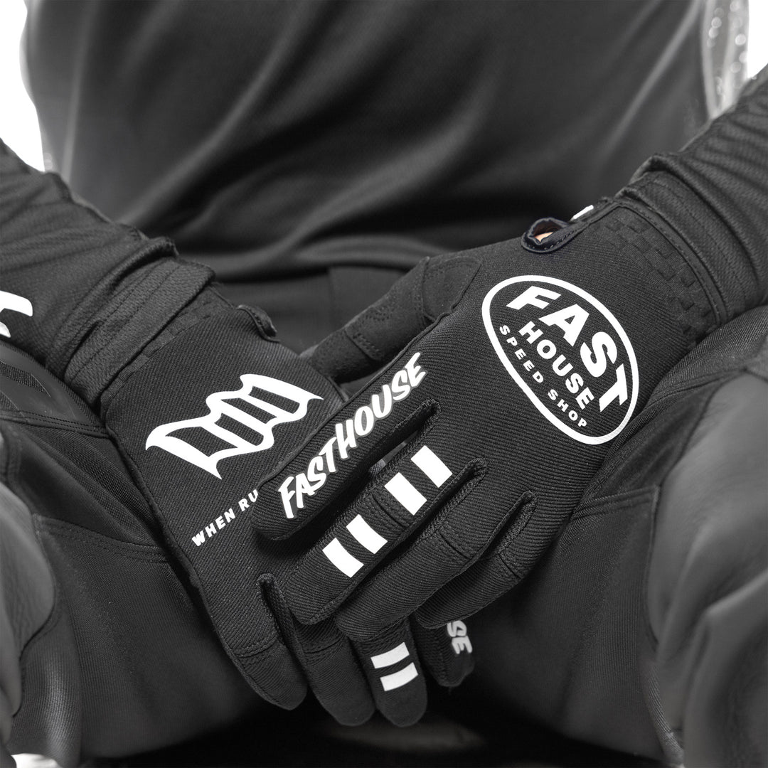 Fasthouse Speed Style Ramble Gloves Black - Close-Up of Model Wearing Gloves, Hands Resting in Lap
