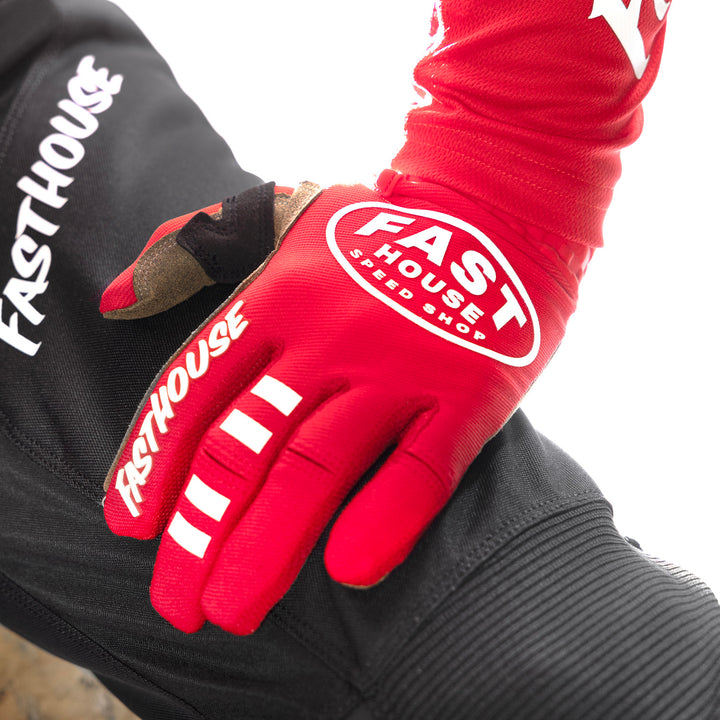 Fasthouse Speed Style Ramble Gloves Red - Close-Up of Model Wearing Glove, Left Hand Resting on Left Thigh