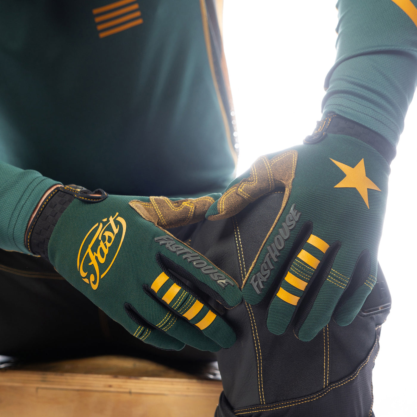 Fasthouse Speed Style Ramone Gloves Pine/Black - Close-Up of Model's Gloved Hands Resting on Knee