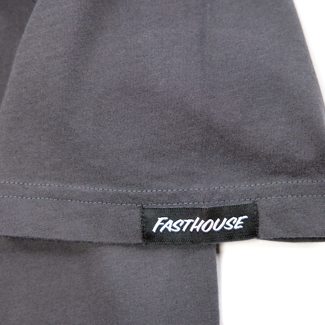 Fasthouse Spanner SS Tee Graphite Black - Close-Up of Logo Tag on Sleeve