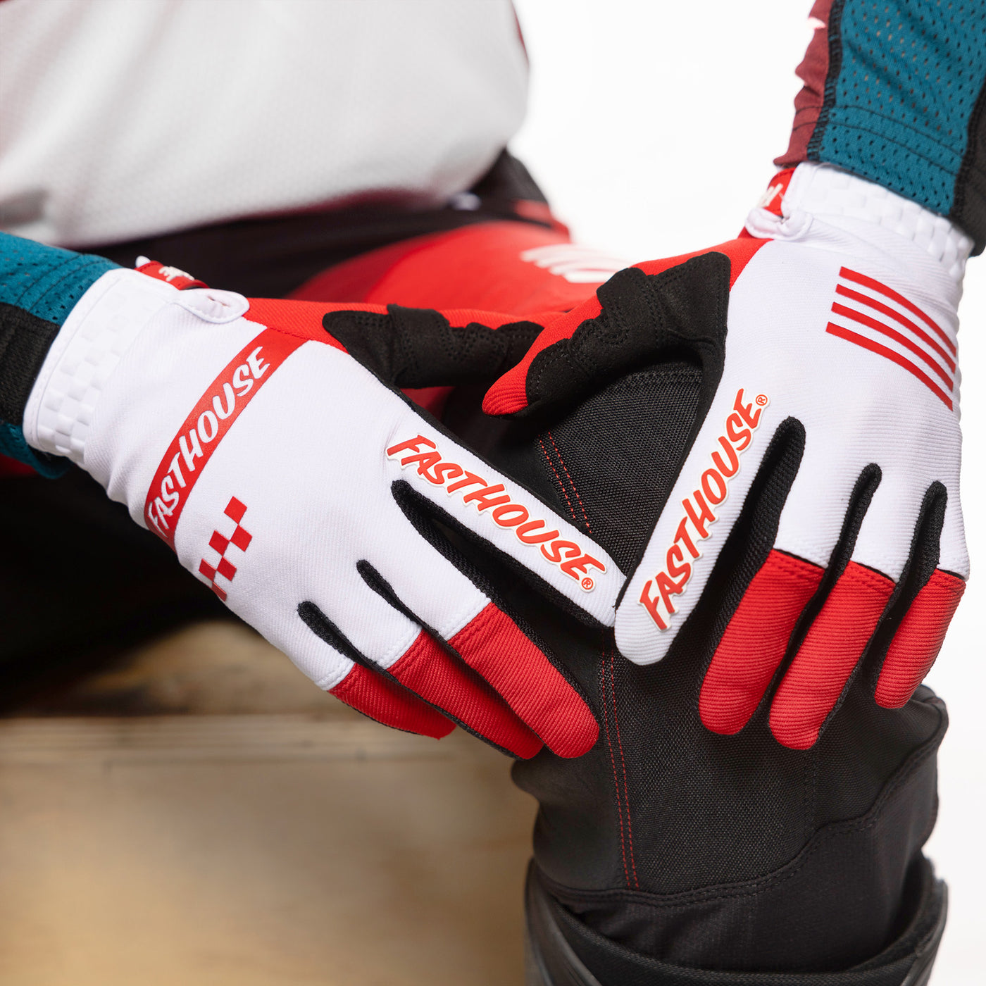 Fasthouse Speed Style Mod Gloves Red/White - Close-Up of Gloved Hands Resting on Knee