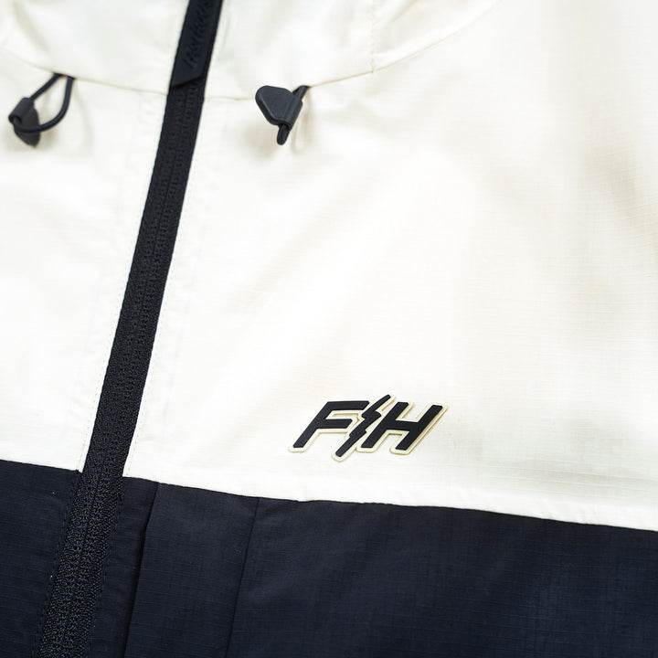 Fasthouse Statement Packable Windbreaker Natural/Black - Close-Up of Logo on Front