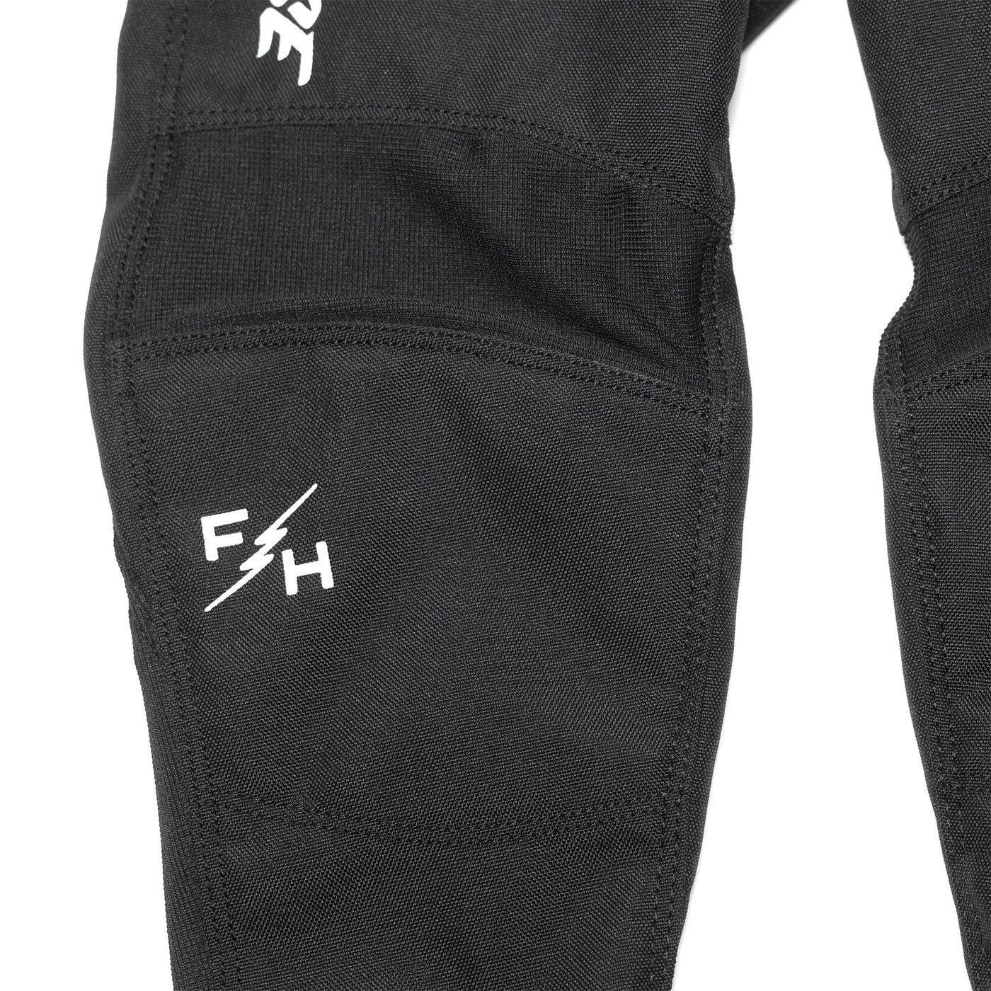 Fasthouse Toddler El Nino Pant Black - Close-Up of Knee Graphic and Details