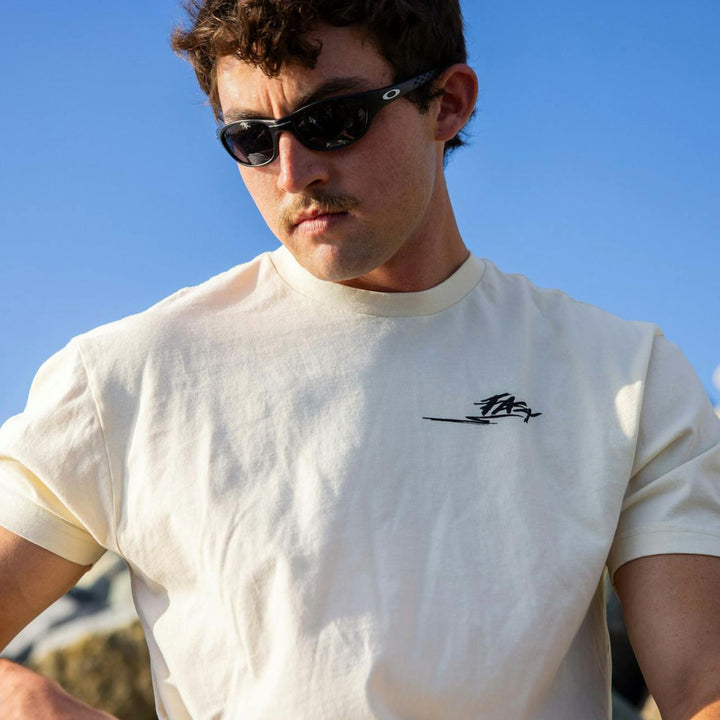 Fasthouse Tomahawk SS Tee Natural - Lifestyle Close-Up of Man in Sunglasses Wearing Shirt