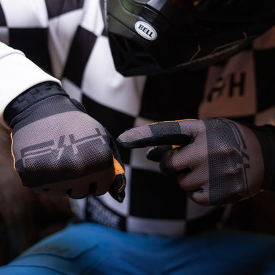 Fasthouse Vapor Ray Gloves Gray - Lifestyle Close-Up of Model With Gloved Hands, Pointing with One at Back of Other