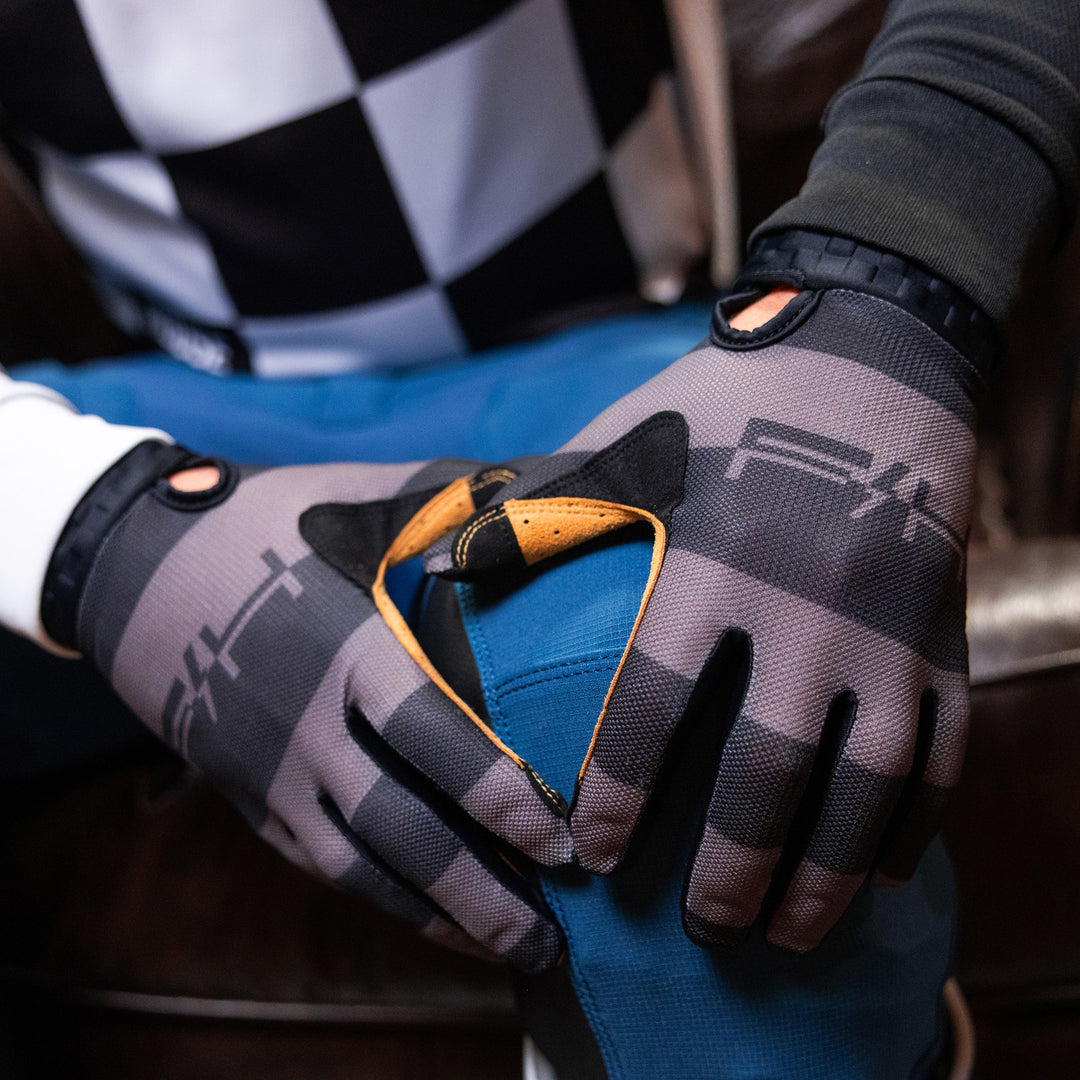 Fasthouse Vapor Ray Gloves Gray - Lifestyle Close-Up of Model's Gloved Hands Resting on Knee