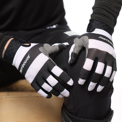 Fasthouse Vapor Jailbird Gloves Black/White - Model Posing with Gloves Resting on Knee