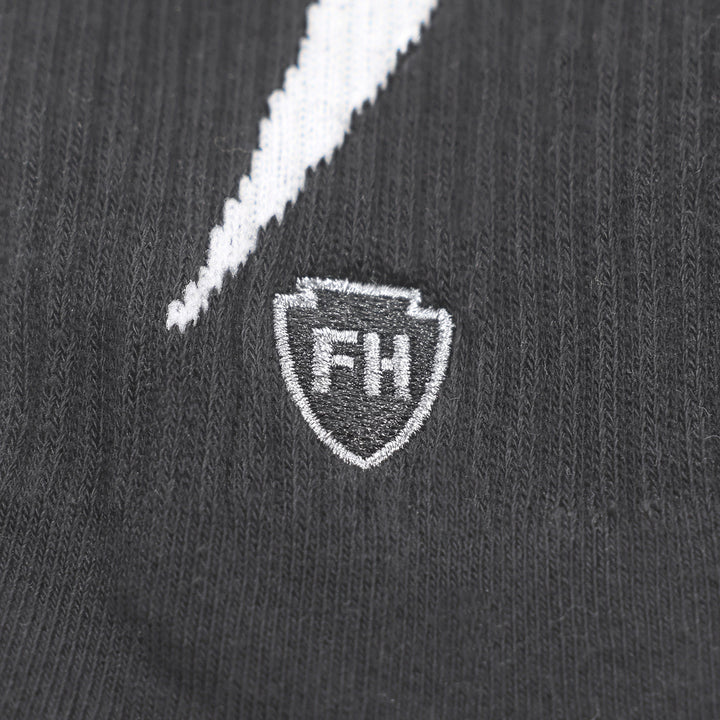 Fasthouse Wired Socks Black - Close-Up of Stitched Logo