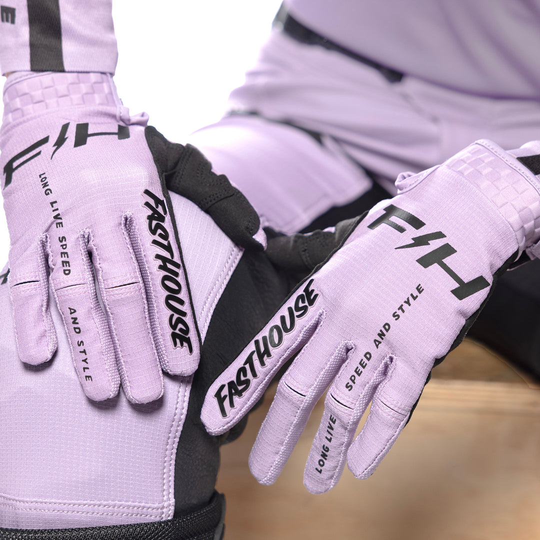 Fasthouse Women's Elrod Nitro Gloves Smokey Lilac - Close-Up of Model Wearing Gloves, Hands Resting on Right Knee