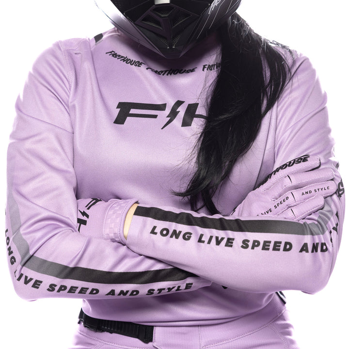Fasthouse Women's Elrod Nitro Jersey Smokey Lilac - Close-Up of Front Graphic with Model's Arms Crossed, Showing Sleeve Graphics as well