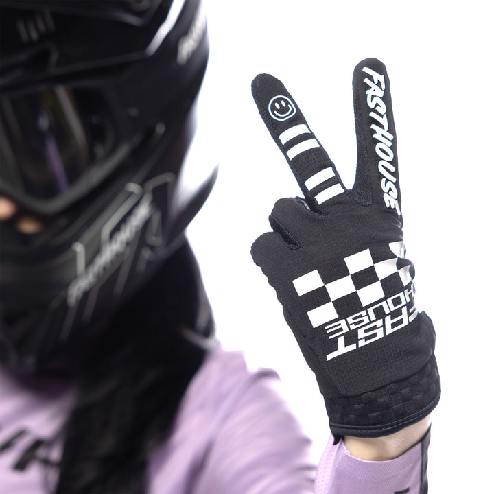 Fasthouse Women's Elrod Xenon Gloves Black - Close-Up of Model Wearing Gloves, Holding Up Left Hand in Peace Sign